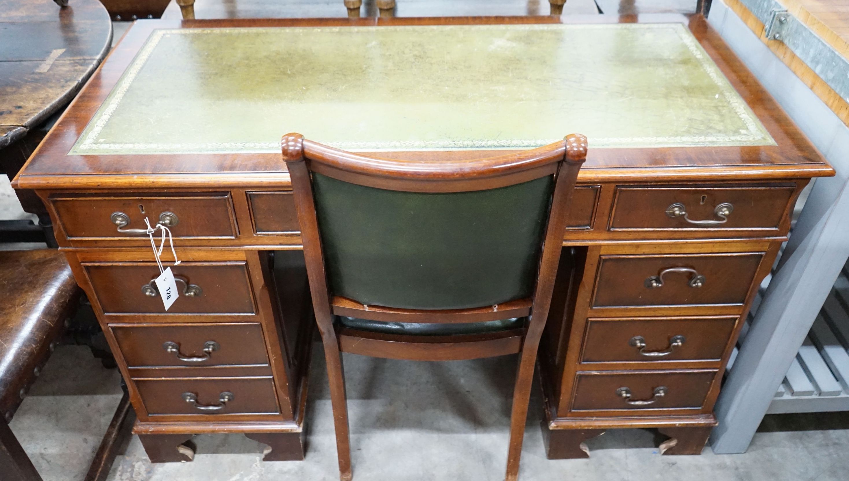 A reproduction mahogany pedestal desk, width 122cm, depth 60cm, height 77cm and chair